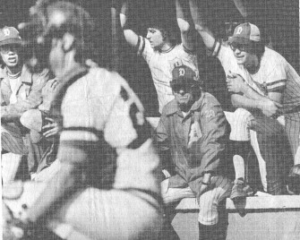 A Concerned Look covers the face of Downingtown coach Carl Houp (windbreaker) as he watches the action in yeterday's title game at Pottstown. To the right is Whippet first baseman Billy Dague (glasses), who scored one of Downingtown's three runs in a 3-2 victory. Photo by Larry McDevitt