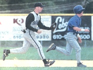 Downingtown's Matt Smith, right, tires to get back to second to avoid being tagged out by Waynesboror's Justin Warner during Monday's PIAA Class AAA Tournament first-round game.  Photo by Larry McDevitt